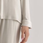 Muse Long PJs — Dusk: Soft, beige long-sleeve pajamas with a subtle white piping detail.