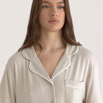 Muse Short PJs — Dusk:  Beige short-sleeve pajama set with white piping detail.