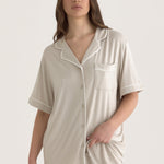 Muse Short PJs — Dusk: Relaxed-fit beige pajama set with short sleeves and shorts, featuring white piping detail.