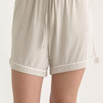 Muse Short PJs — Dusk: Beige women's pajama shorts with a drawstring waist and white piping detail.