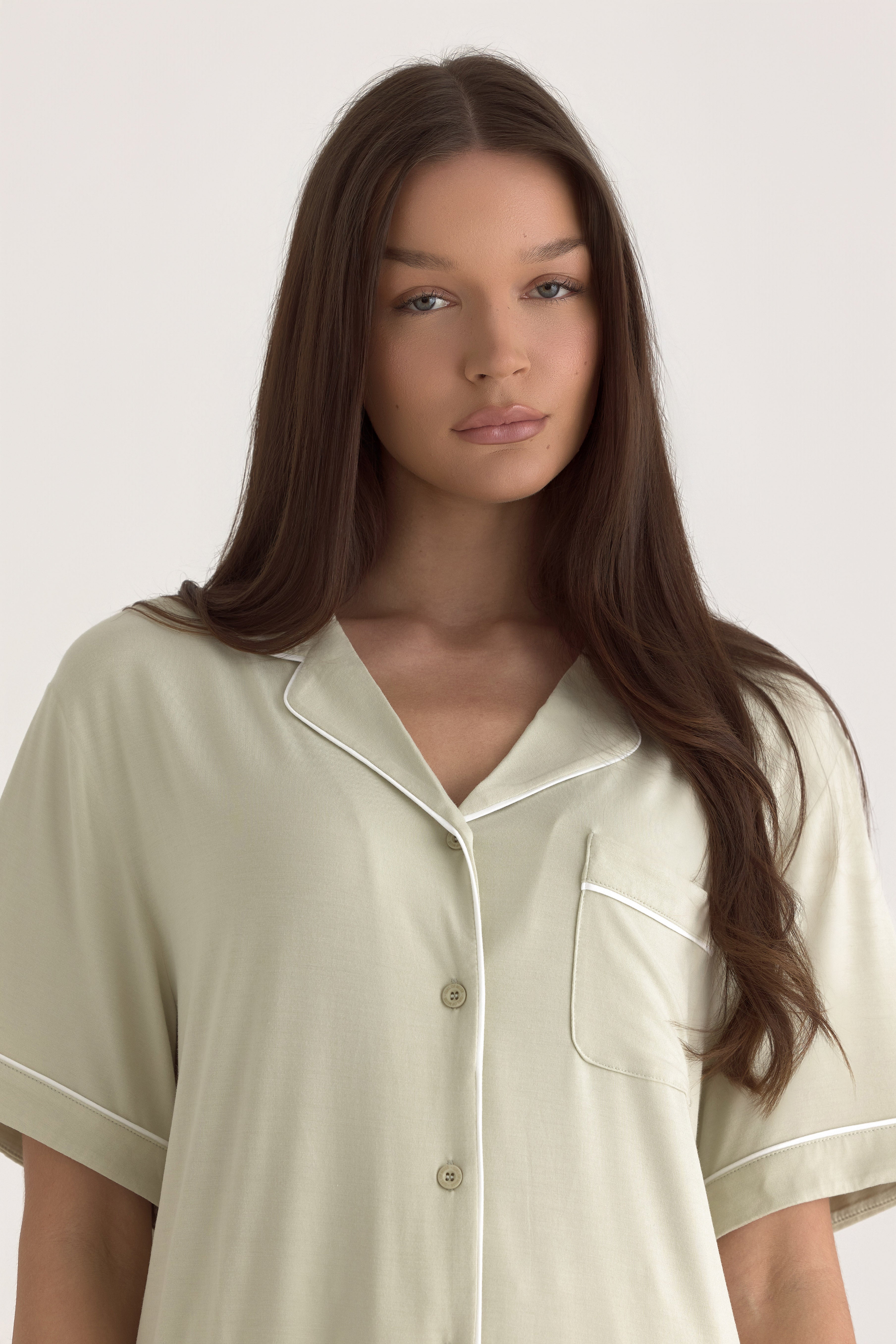 Muse Short PJs in Soft Sage: Comfortable sage green pajama set with short sleeves and a collared top.