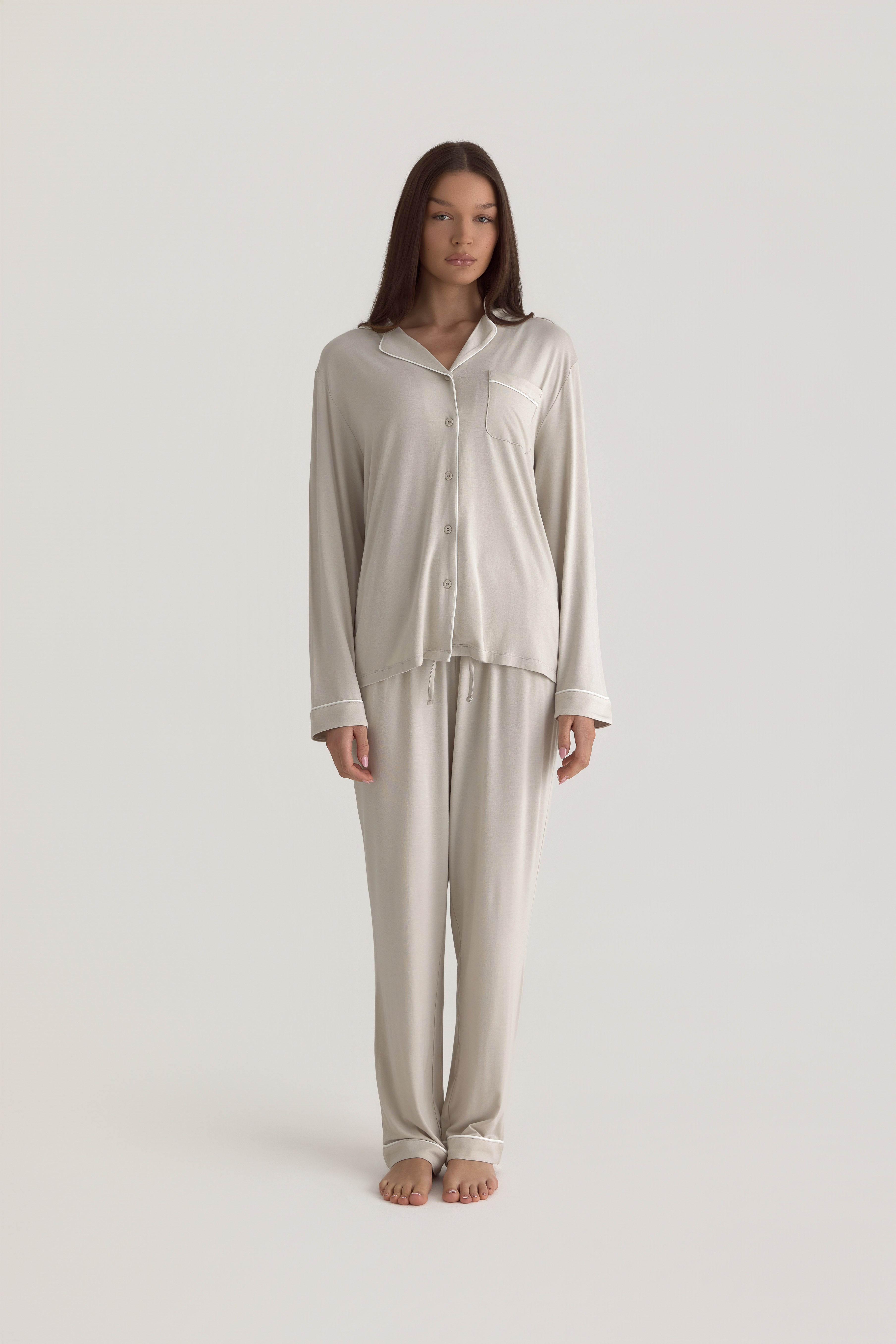 Muse Long PJs — Dusk:  Women's beige long-sleeve pajama set with white piping detail.