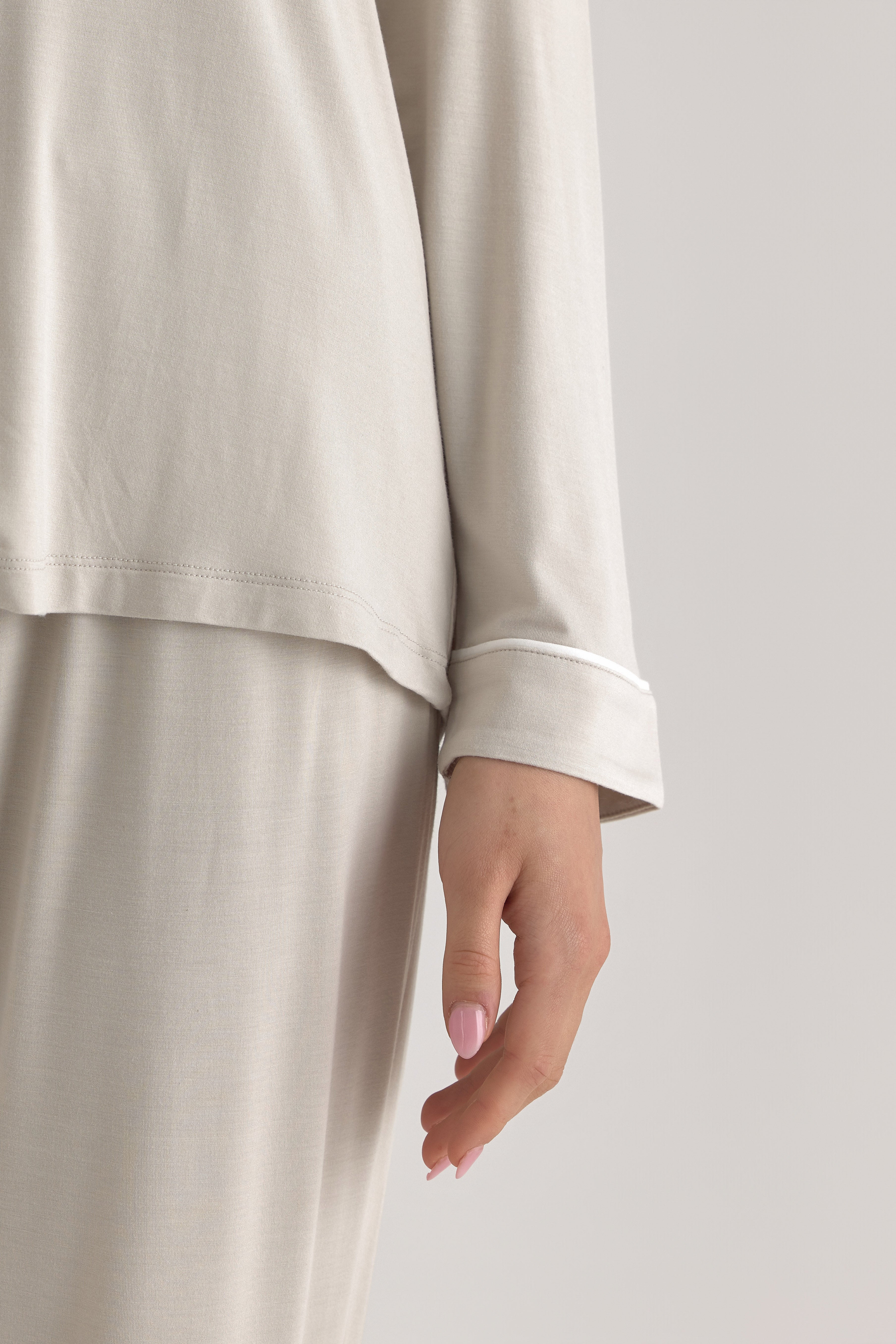 Muse Long PJs — Dusk: Soft, beige long-sleeve pajamas with a subtle white piping detail.