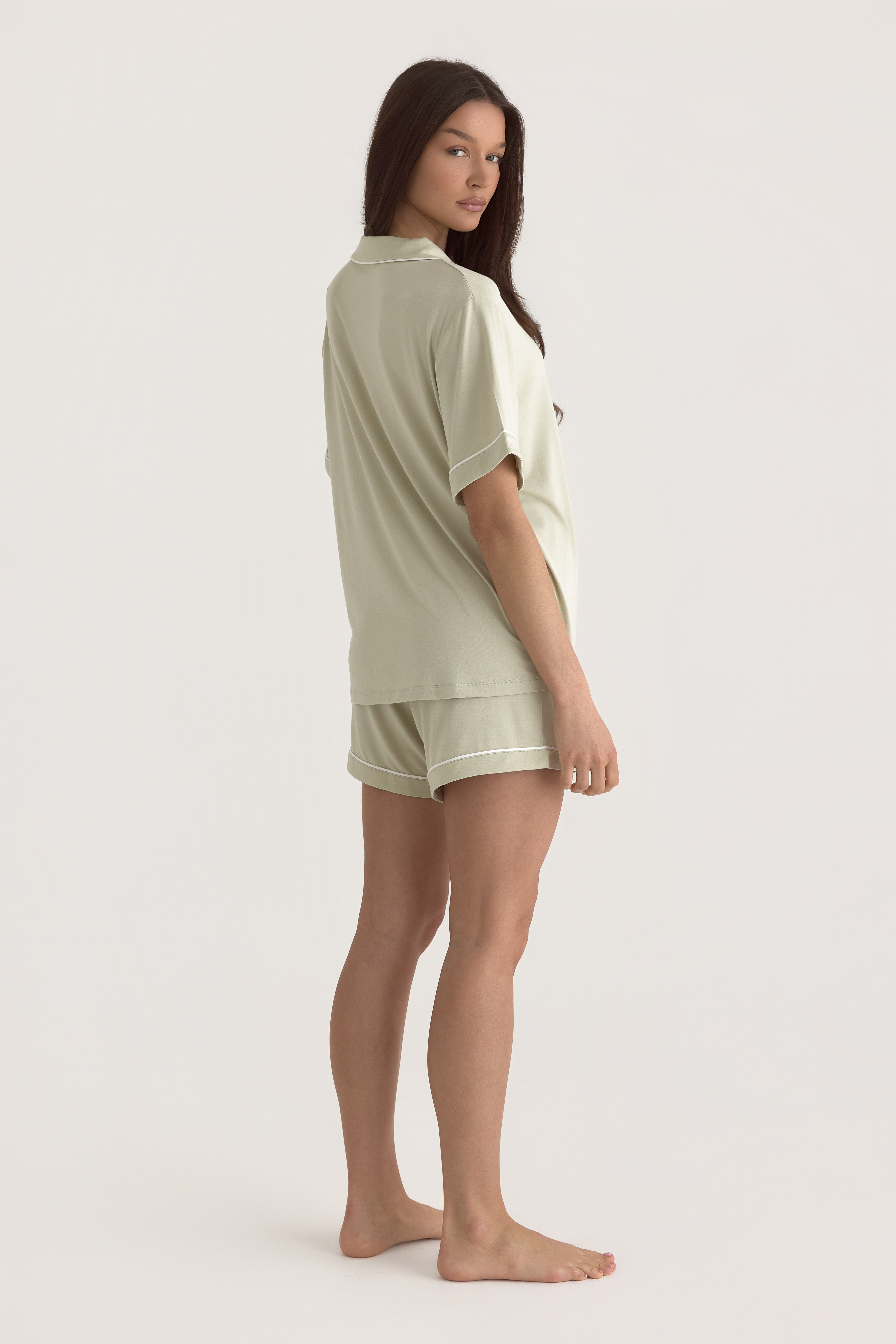 Muse Short PJs in Soft Sage: Women's short sleeve pajama top and shorts set in a light sage green color.