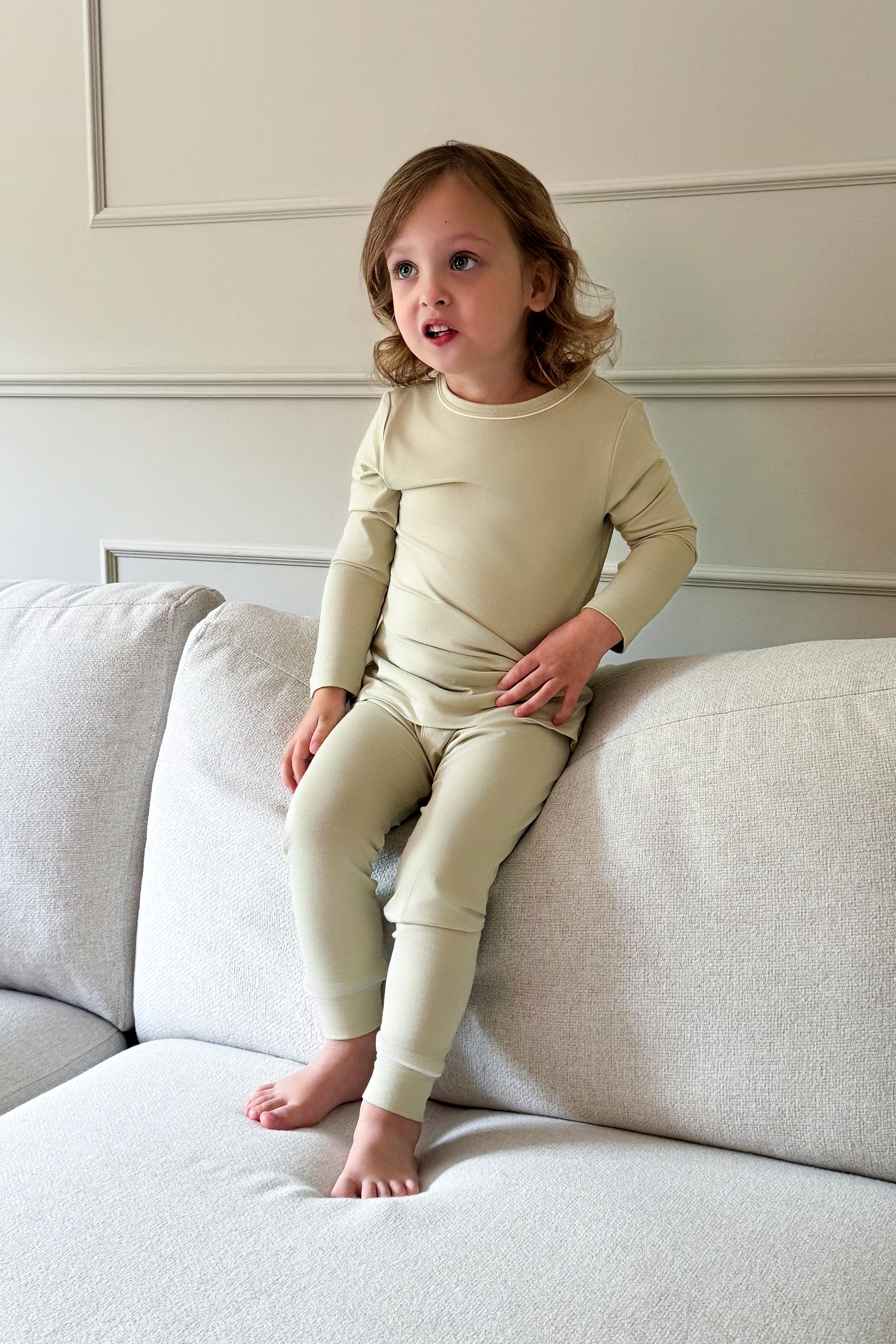 Mini Muse PJs in Soft Sage: Adorable toddler in comfy sage green pajamas